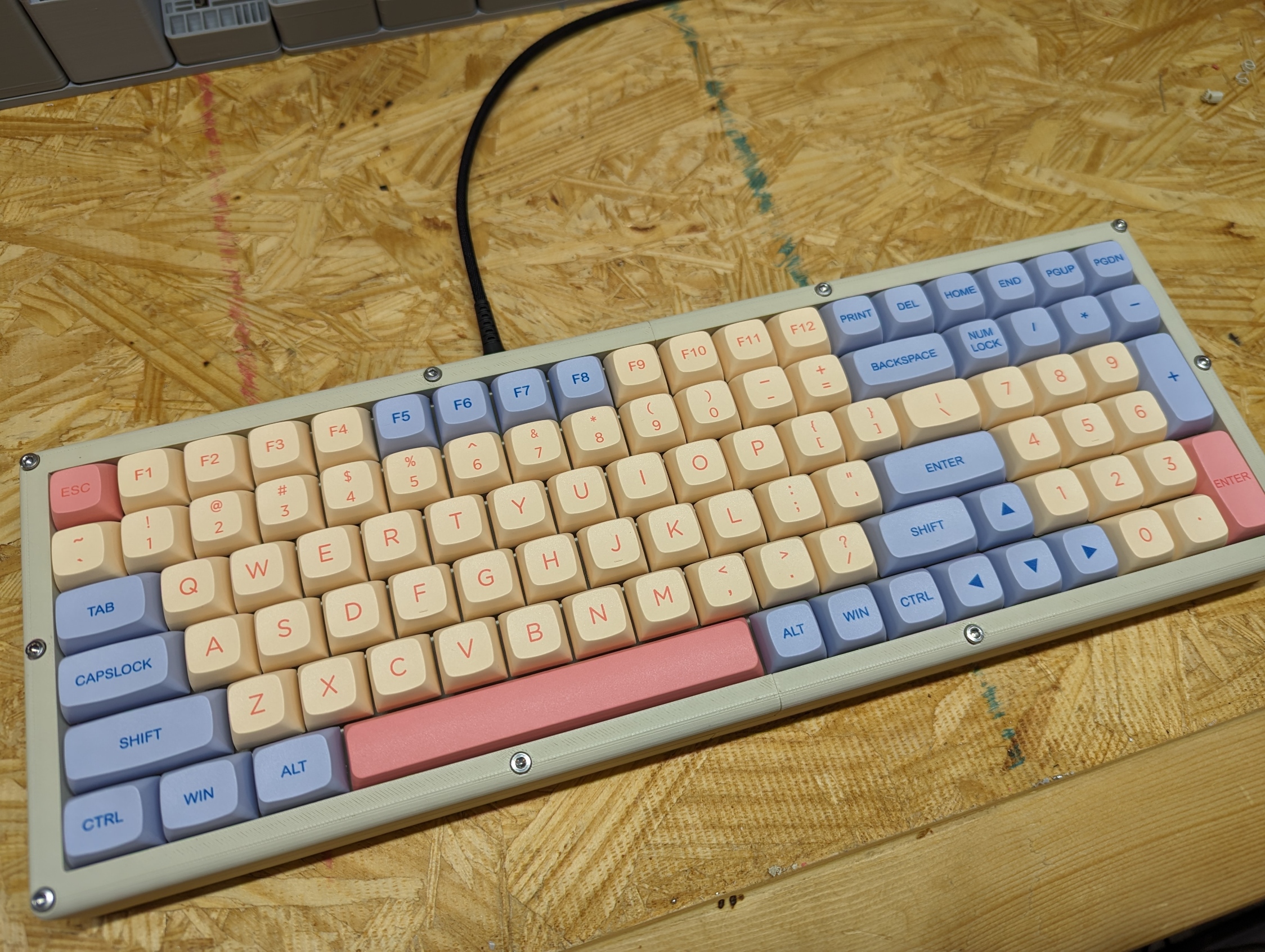 Shoddy looking keyboard that wobbles a bit. Cream colored keycaps